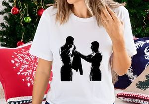 Two silhouetted men engaged in a towel exchange