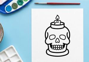 Porta velas de calavera con llama encendida para decoración de Halloween. Jarrón de cerámica con calavera espeluznante que ilumina espacios oscuros con un resplandor siniestro.
