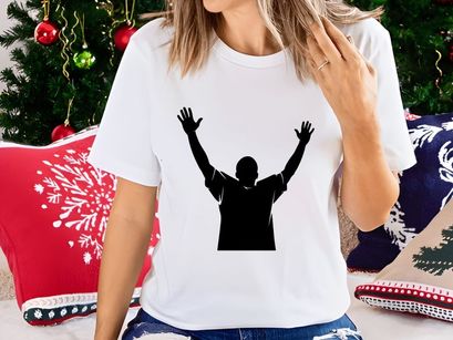 A person standing with arms raised in triumph or celebration