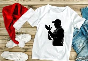 Silhouette of a man in a baseball cap gesturing with his hands