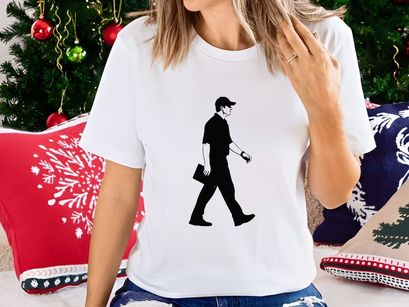 A man walking to the right with a briefcase in his hand