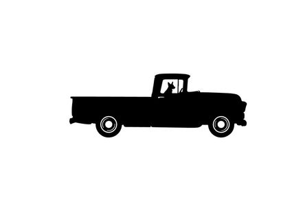 Silhouette of a classic pickup truck with a dog