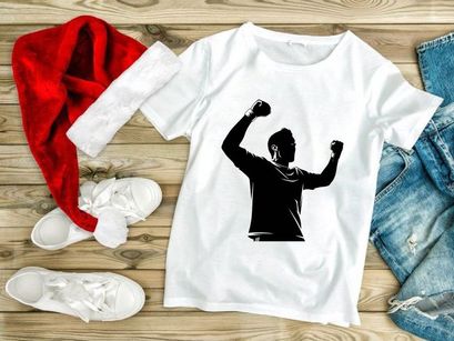 A man celebrating with fists raised in triumph and excitement