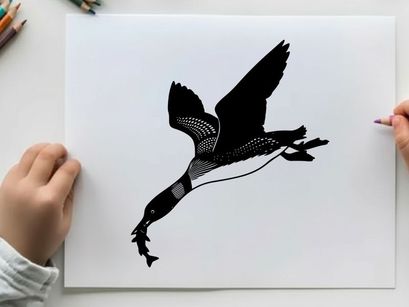 Silhouette of a canada goose in flight with outstretched wings