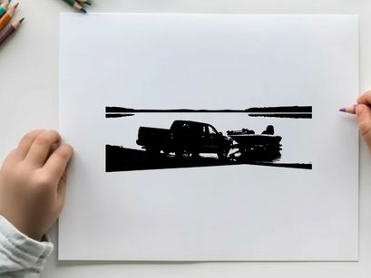 Silhouette of a pickup truck towing a boat on a road by the water