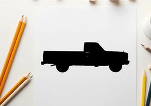 Silhouette of a classic pickup truck against a white background