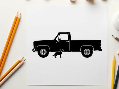 Silhouette of a pickup truck with a dog