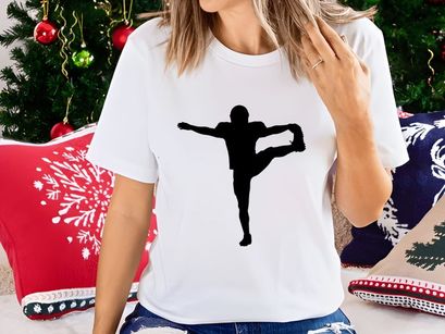 Silhouette of a person performing a yoga or dance pose