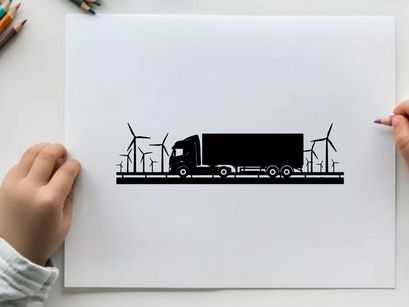 Truck silhouette driving past wind turbines on a sunny day