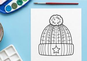 Winter knit beanie hat with pom pom and star icon, black and white line art illustration.