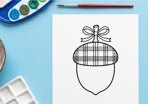 Cute Christmas ornament hanging on a string. Festive holiday decoration with a plaid pattern and bow, ideal for seasonal marketing and greeting cards.