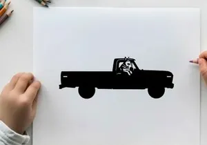 Silhouette of a pickup truck with a dog