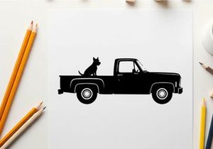 Silhouette of a dog sitting in the back of a pickup truck