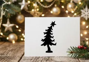 Black Christmas tree silhouette with star topper isolated on white background