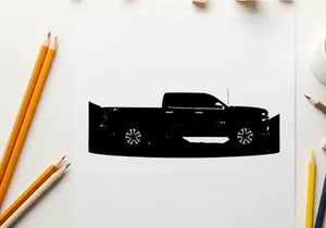 Silhouette of a pickup truck against a mountain range silhouette