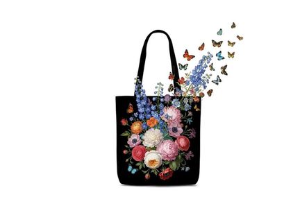 Vibrant floral silhouette design on black tote bag with butterflies