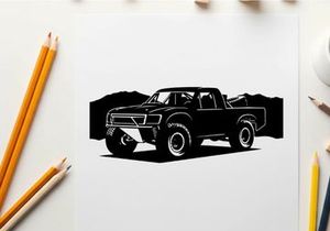 Silhouette of a pickup truck in front of mountains