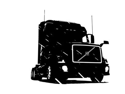 Silhouette of a large truck with a volvo front grille