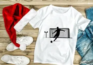 Soccer player kicking ball into goal with silhouette