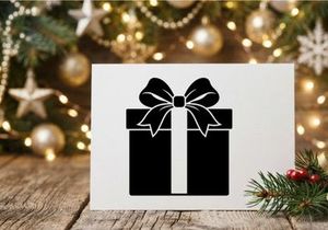 Schwarze und weiße Geschenkbox mit Schleife für Weihnachten oder Feierlichkeiten