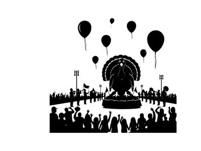 Silhouette of a crowd celebrating with balloons and a large statue