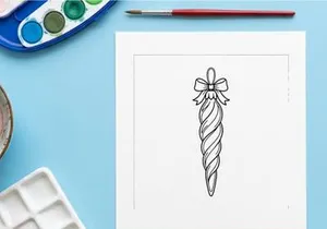 Hand-drawn Christmas candy cane with snowflake bow isolated on white background