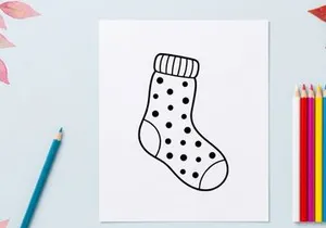 Christmas stocking icon with polka dot pattern, simple black and white line art drawing.