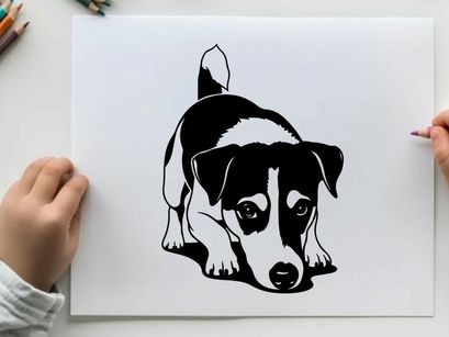 Silhouette of a cute black and white dog crouching down
