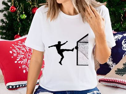 Soccer player kicking ball into goal net in dynamic motion