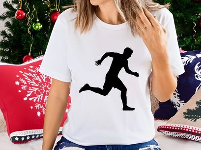 A silhouette of a man running quickly with athletic posture and movement