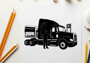 Silhouette of a man standing beside a large semi truck