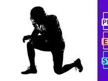 American football player in a kneeling position on the field in black silhouette