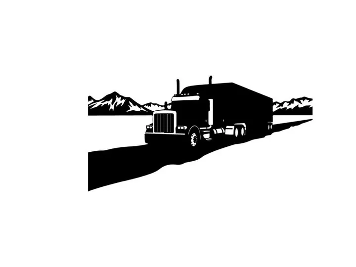 Silhouette of a semi truck driving on a road with mountains