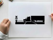 Truck silhouette crossing railroad tracks with warning signs