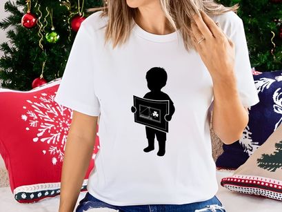 Child Holding Artwork with Shamrock