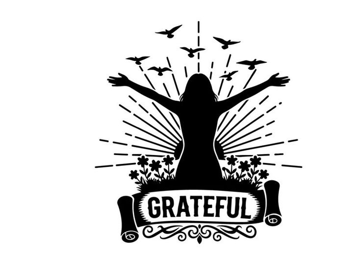 Silhouette of a woman expressing gratitude with birds and flowers