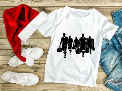 Silhouette of soccer players walking with sports equipment