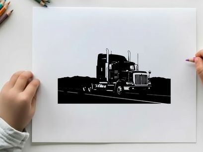 Silhouette of a semi truck driving on a highway with mountains