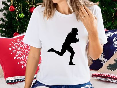 American football player running with ball in hand silhouette