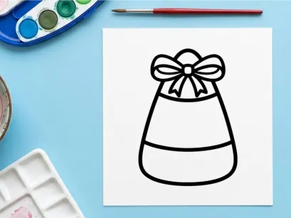Candy corn icon with a bow. Halloween treat graphic for seasonal holiday design projects.