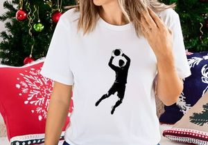 A volleyball player jumping to spike the ball in mid air with dynamic movement