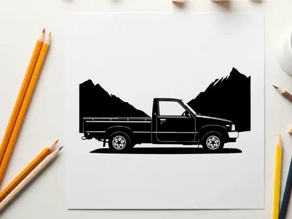 Silhouette of a pickup truck in front of mountains