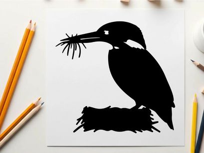 Silhouette of a kingfisher bird with twigs in its beak profile view