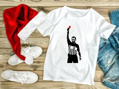 Referee holding a red card in a sports game for penalty or ejection