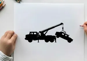 Silhouette of a tow truck lifting a car with a crane