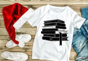 Stack of black books with quill pen education knowledge concept