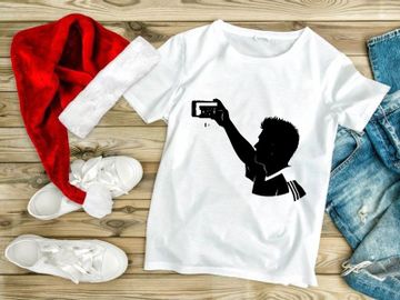 Silhouette of a boy taking a selfie with a smartphone preview picture