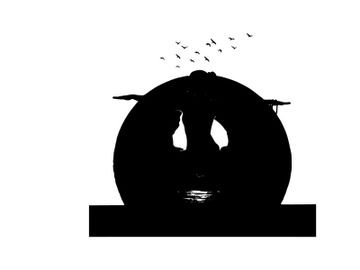 Silhouette of a woman practicing yoga at sunset preview picture