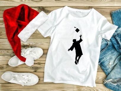 Graduate throwing cap in air, silhouette, graduation celebration