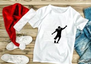 American football player kicking a ball in motion silhouette